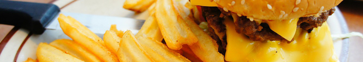 Eating Burger Chicken Wing Pub Food at BoomerJack's Grill & Bar restaurant in Dallas, TX.